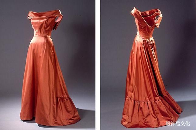 长款无袖派对礼服,采用深色金色公爵夫人真丝缝制而成。 公主风格的铁锈色派对礼服