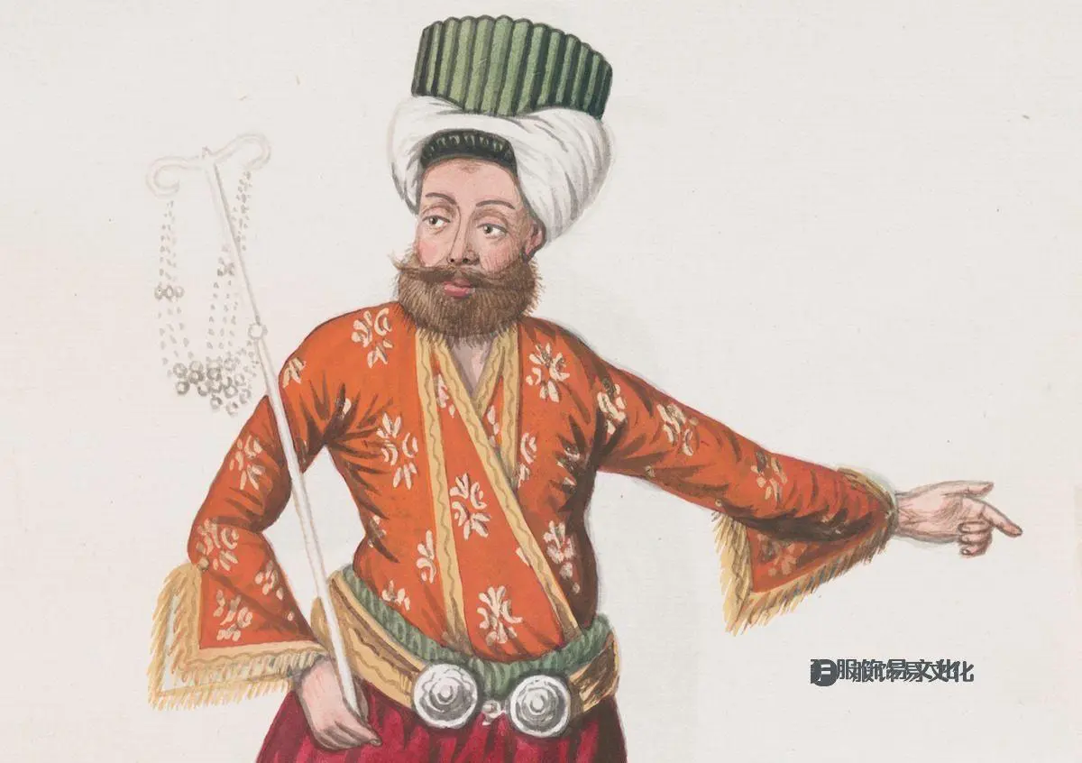 一位游行领袖用一只手做手势，另一只手挥舞着珠子摇动器。